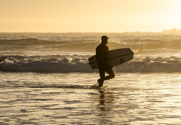 Surfing in Tofino by Sara Satterlee